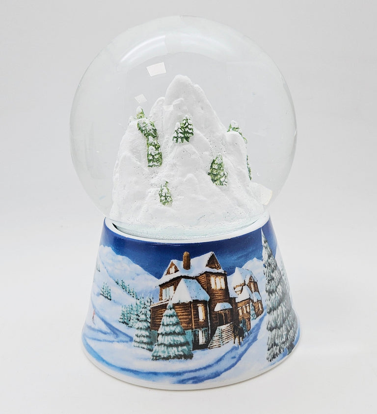 Nostalgische Schneekugel Bergdorf auf Sockel Winterlandschaft mittelblau 100 mm Durchmesser mit Spieluhr - Schneekugelhaus