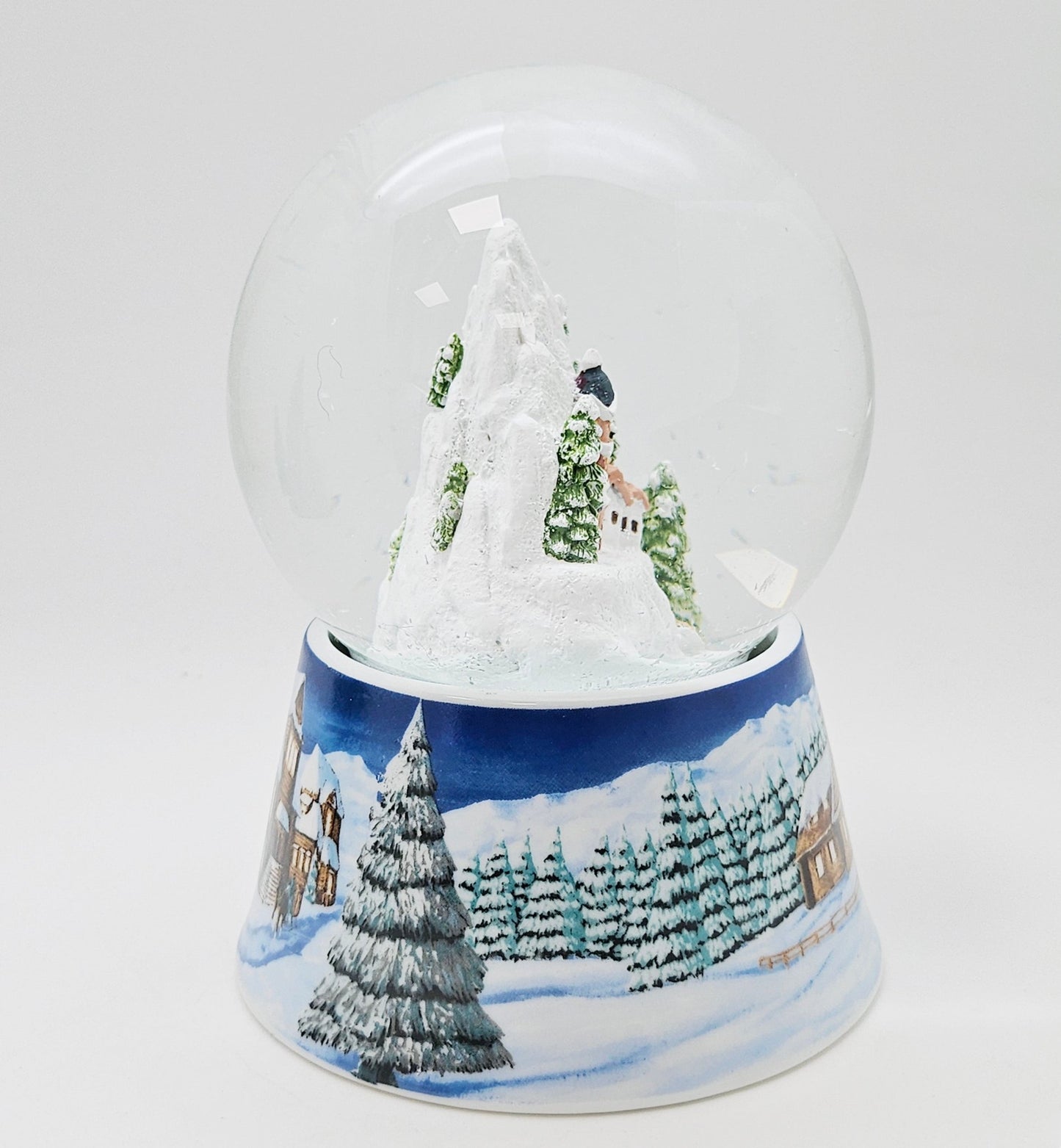 Nostalgische Schneekugel Bergdorf auf Sockel Winterlandschaft mittelblau 100 mm Durchmesser mit Spieluhr - Schneekugelhaus