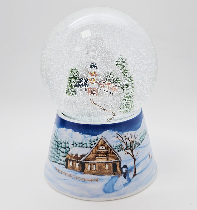 Nostalgische Schneekugel Bergdorf auf Sockel Winterlandschaft mittelblau 100 mm Durchmesser mit Spieluhr - Schneekugelhaus