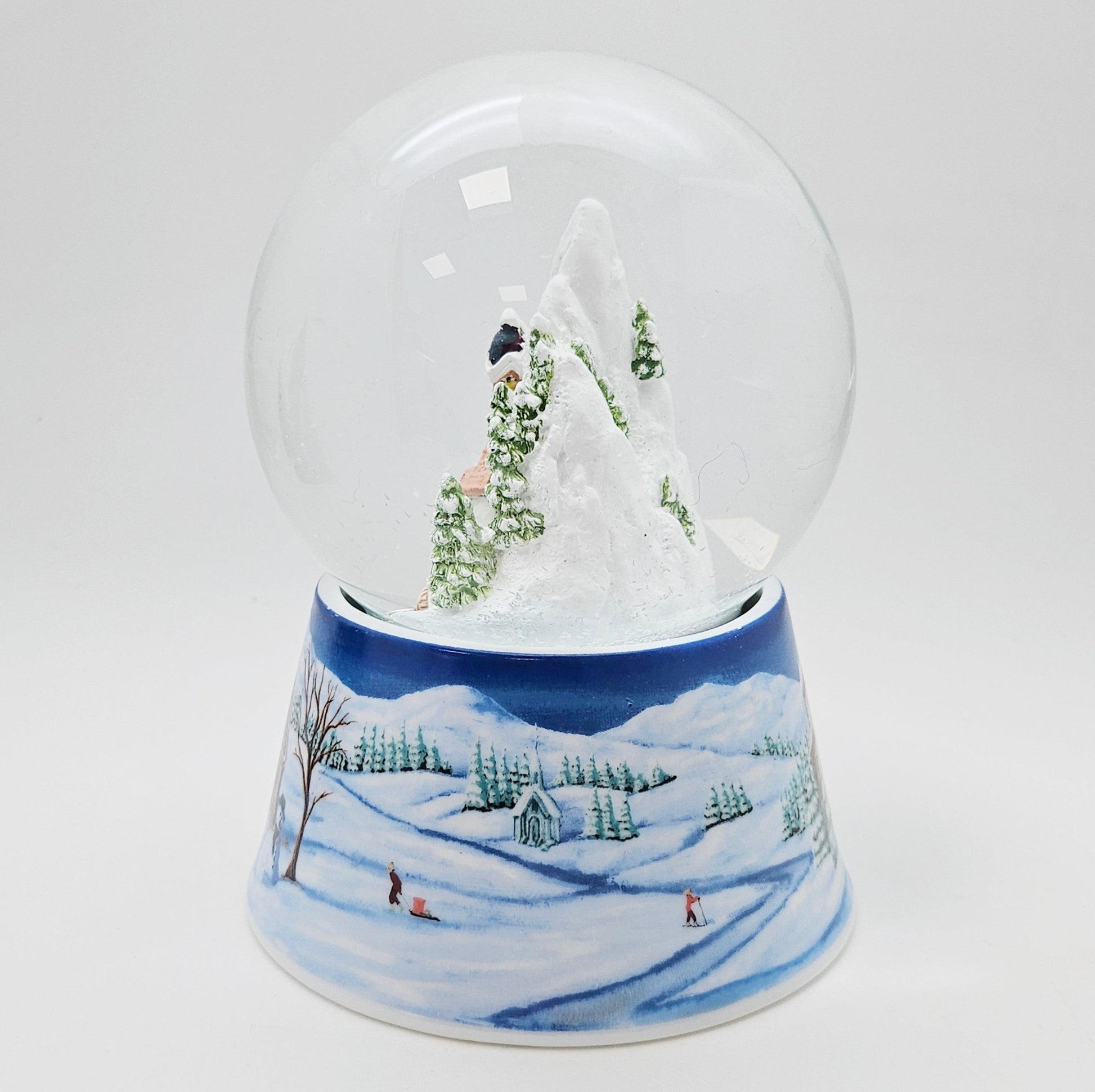 Nostalgische Schneekugel Bergdorf auf Sockel Winterlandschaft mittelblau 100 mm Durchmesser mit Spieluhr - Schneekugelhaus