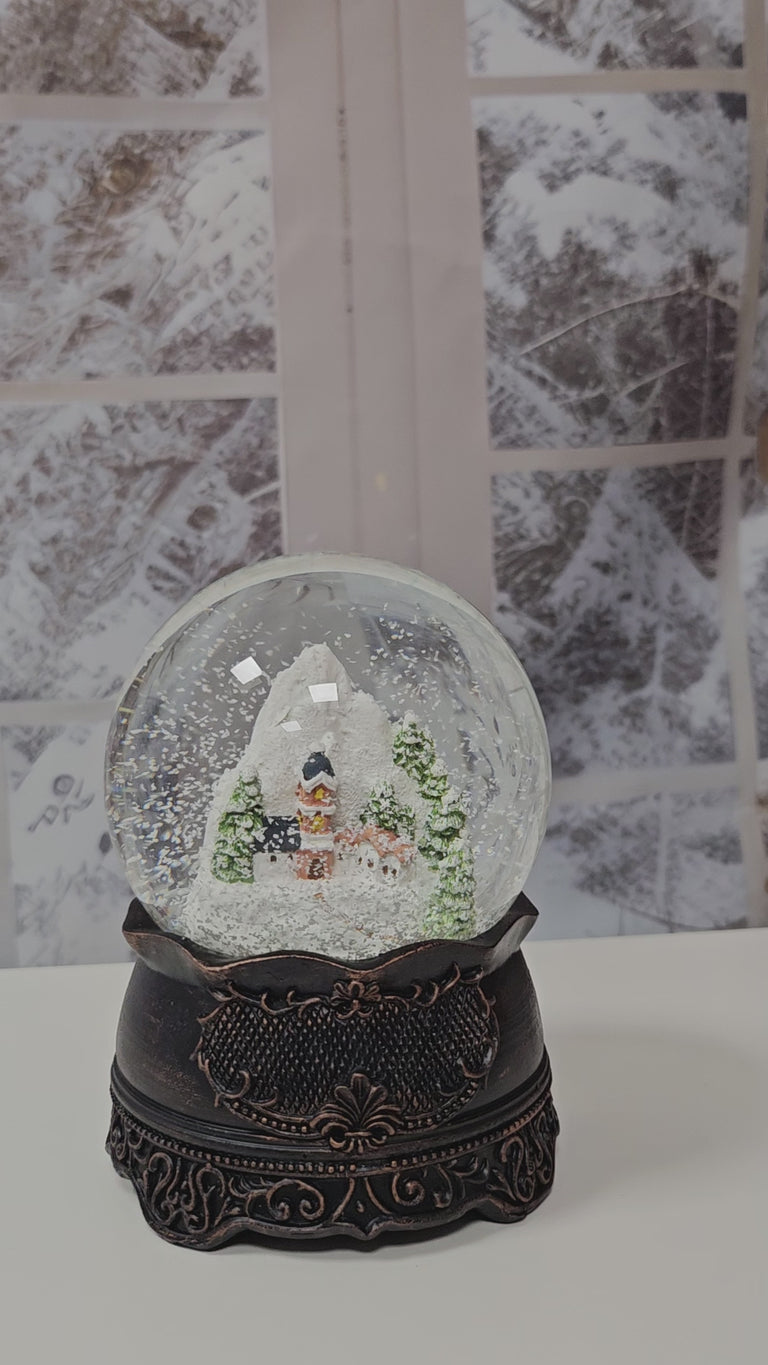 Nostalgische Schneekugel Bergdorf auf Ornamentsockel kupfer antik 100 mm Durchmesser mit Spieluhr